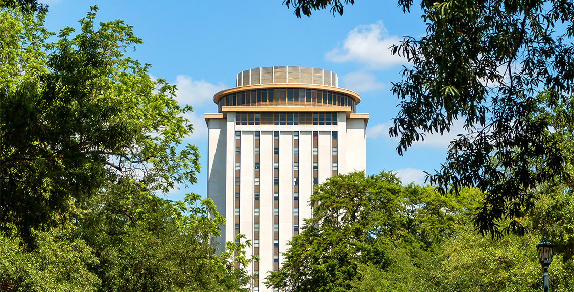 Capstone building surrounded by trees