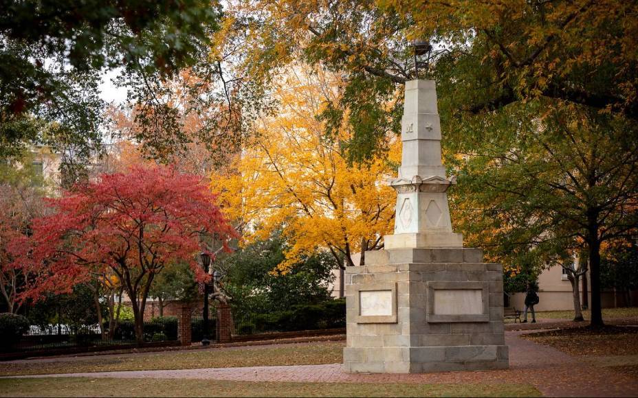 The Maxcy monument on the horseshoe with fall colors in the trees.