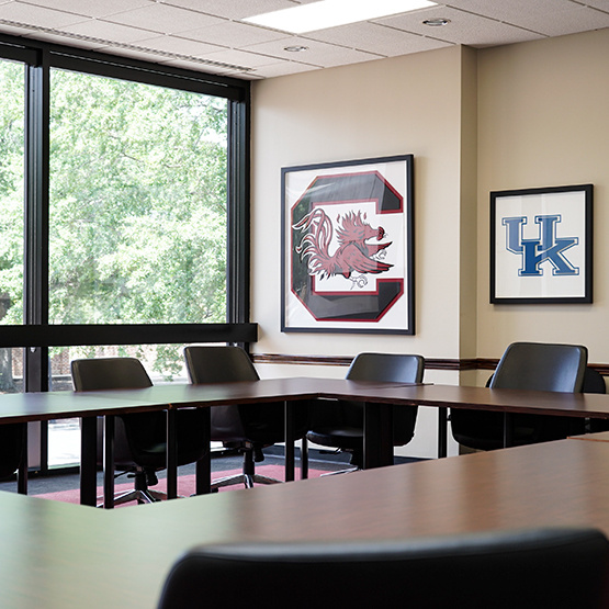 A conference table with comfortable-looking chairs.