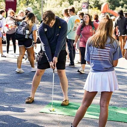 gamecock entertainment student putting 