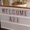 photo reads welcome to AJI