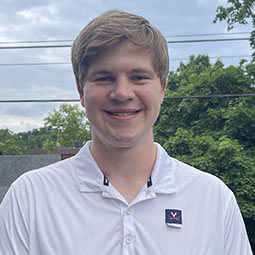 man with white polo shirt on outside