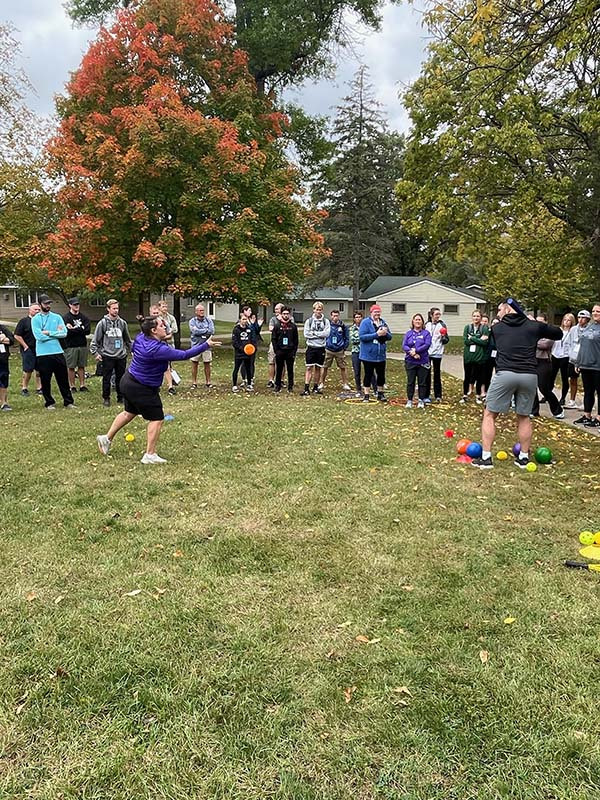 Jennifer Heebink leading a group in an outdoor activity.