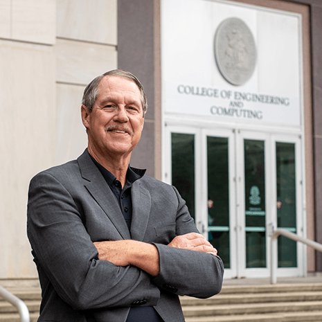 Michael Sutton in front of the Swearingen Building