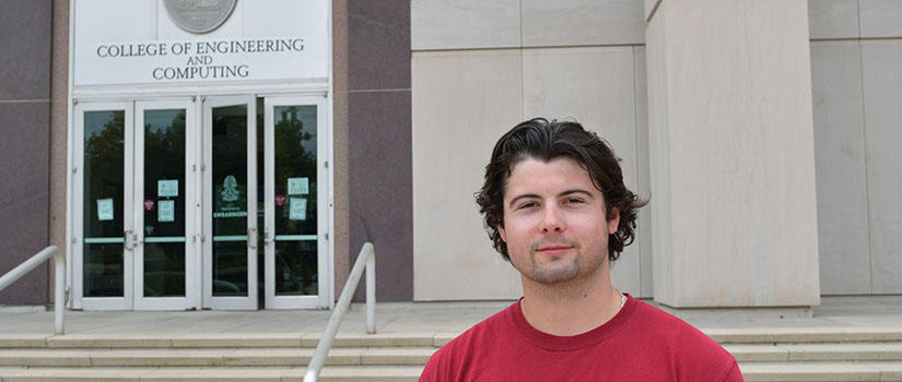 Electrical Engineering senior Nick Wood standing in front of Swearingen Hall.