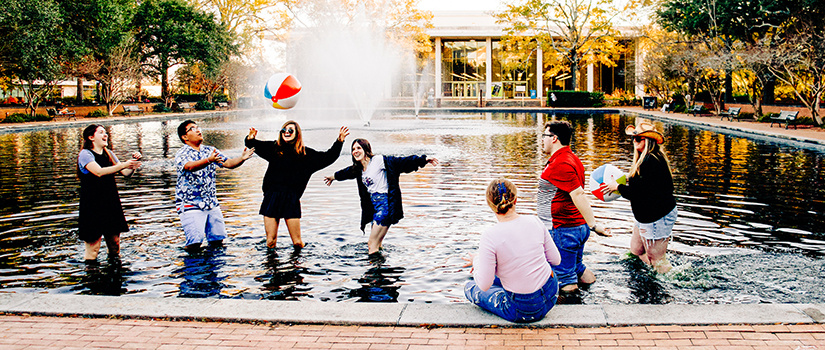 Top scholars playing in fountain.