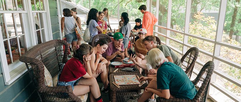 Group of Top Scholars playing board games at their first-year retreat.