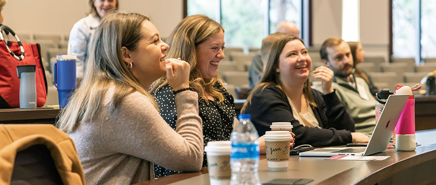 Attendees of the Law Review Symposium conversing