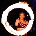Alanna Hopkins spinning a fire baton in a circle