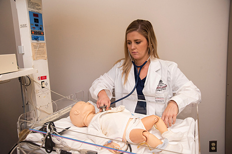 student checking baby pulse 