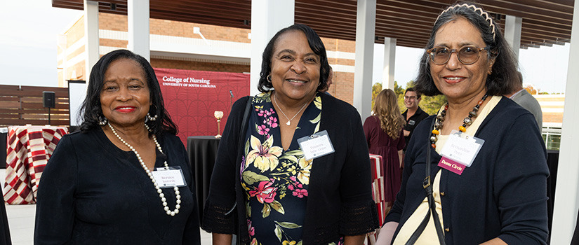 three females smiling 