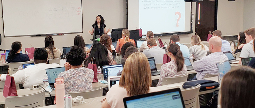 professor addressing class of students