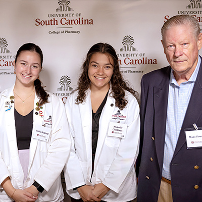 Two students with donor