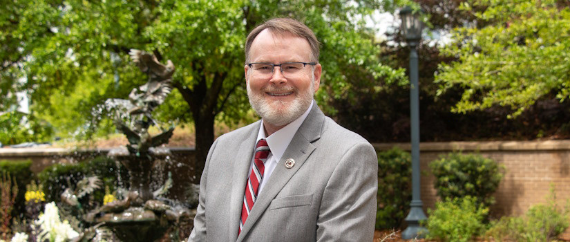 Dean Chandler in front of the fountain