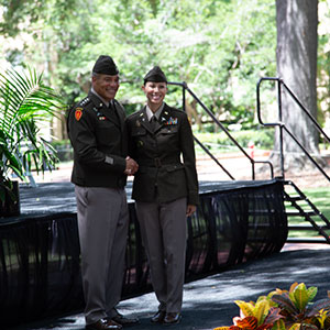 ROTC cadet shakes hands with official at commissioning ceremony in May 2022