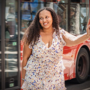 Morgan Epperson smiles while leaning on a payphone book in London, England.