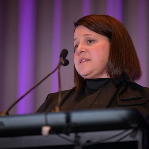 Laura Ashley Thomas speaks at an awards banquet