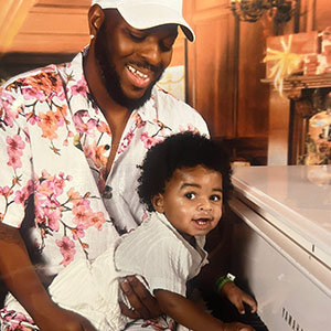 Ira Hogg at the piano with his son, Ira.