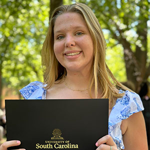 Margaret Cathcart stands in front of the math building.