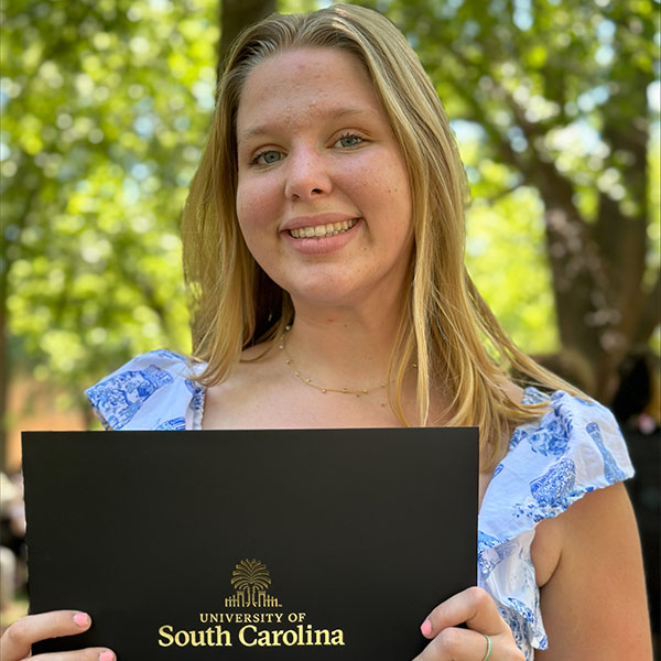 Margaret Cathcart stands in front of LeConte College.